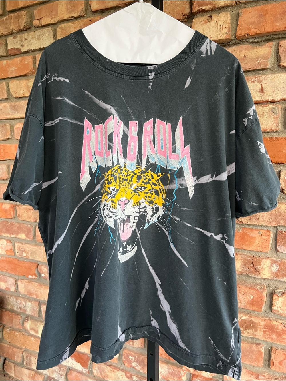 Woman’s Black Rock & Roll Graphic Tee with Pink Text and Yellow Leopard.